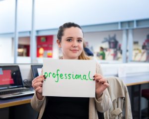 Woman holding sign