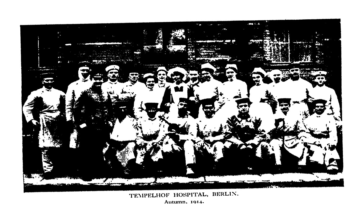 A civilian-military medical unit of male and female doctors, captioned Templehof Hospital, Berlin, Autumn 1914.