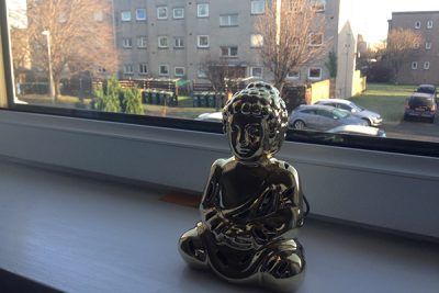Image of Buddha on a windowsill