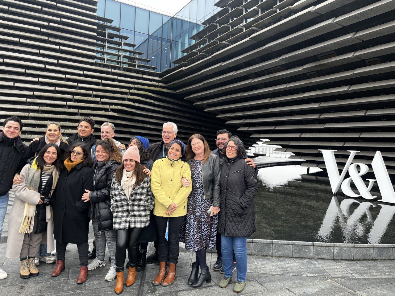 Group picture outside the V&A Dundee showing the cultural leaders with Professors Jane Ali Knight and Gary Kerr