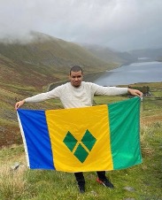 Dr Shemroy holding flag